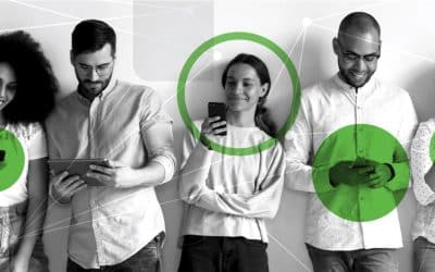 Stock photo of five diverse professionals standing together, discussing over digital devices, highlighted with green and networking graphic accents, representing a collaborative tech environment.