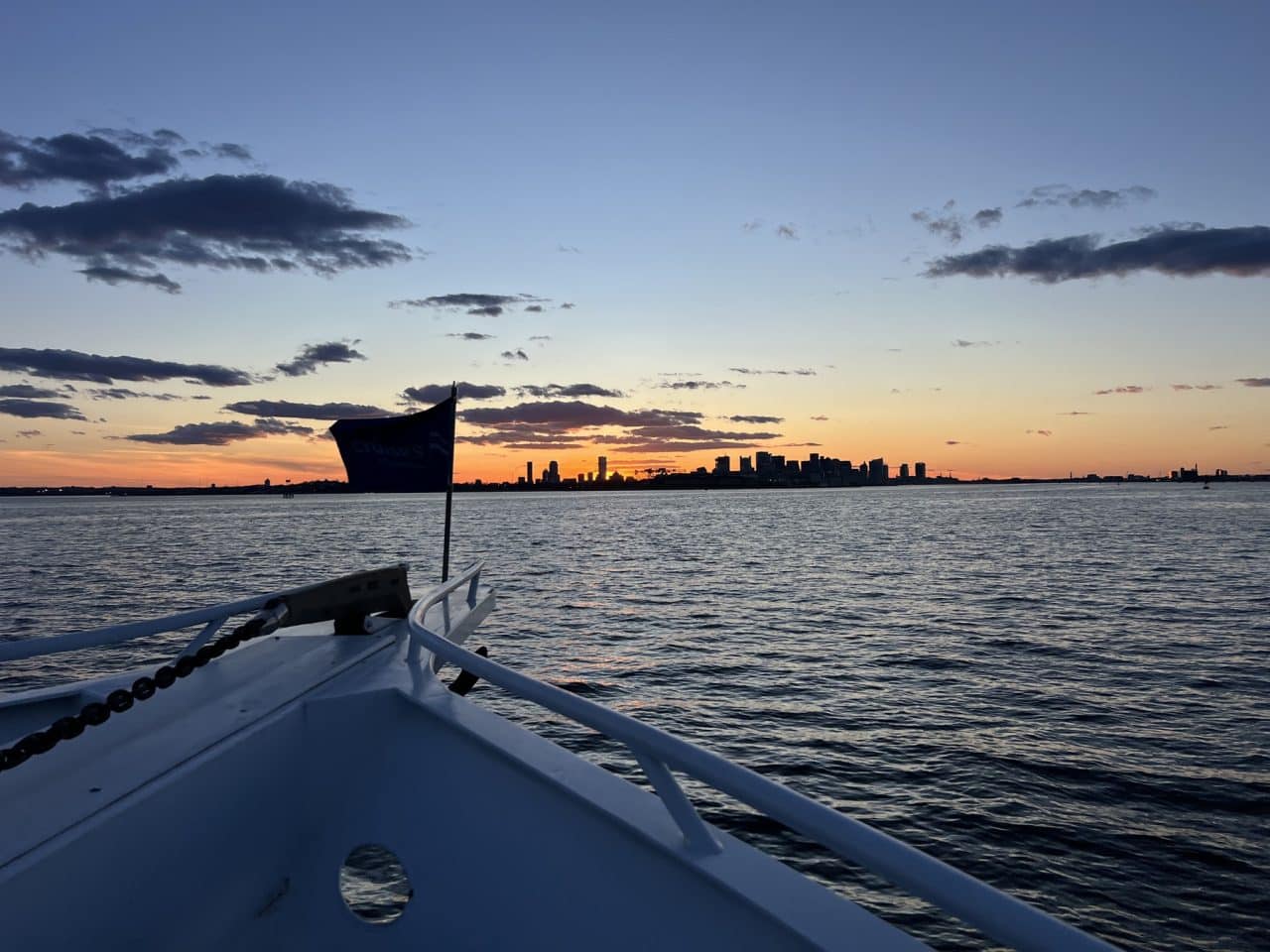 Sunset view of the boat bow during the Bio-IT 2024 Harbor Cruise event.